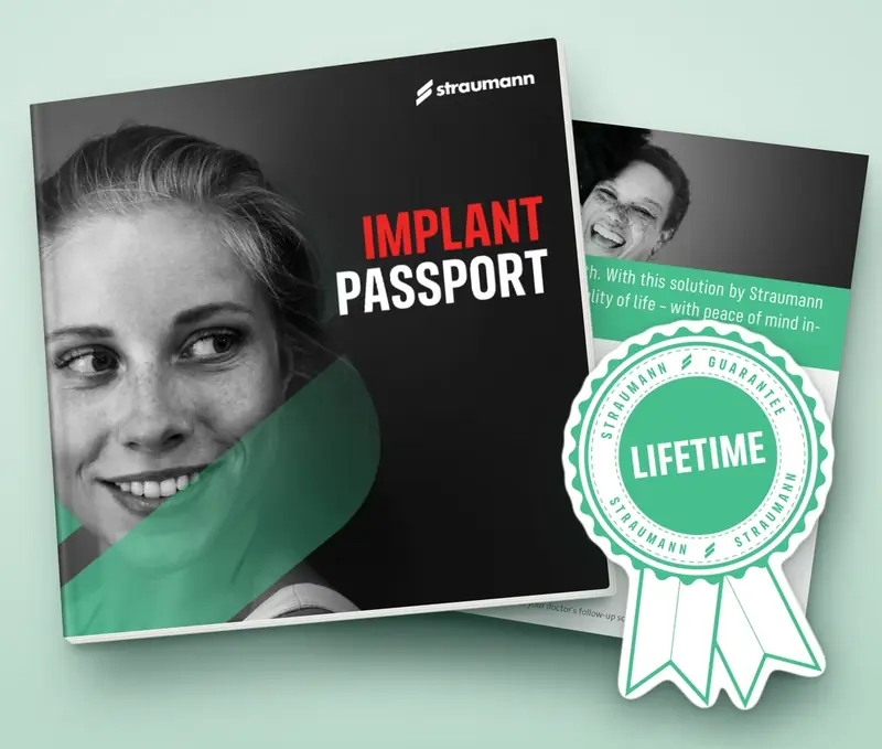 A Straumann Implant Passport booklet, shown with a green Straumann lifetime guarantee seal.